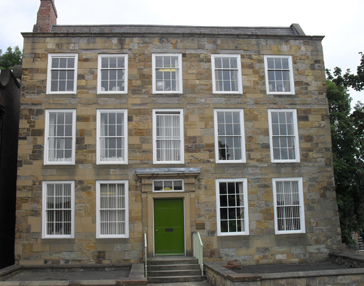 A view of the facade of Abbey House. The uniform appearance of this facade is mis-leading, as the remains of older buildings on the site have been incorporated into its construction. 